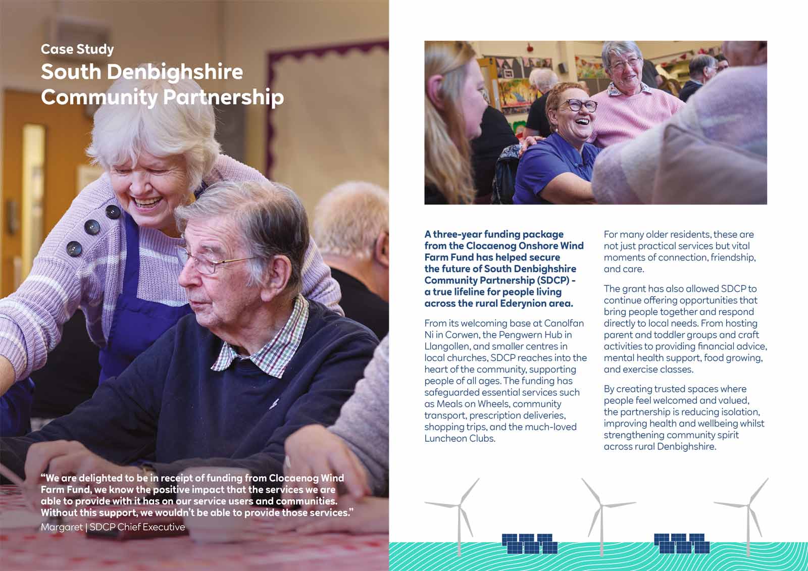 An elderly woman assists another at a community centre, promoting support and connection for local residents.