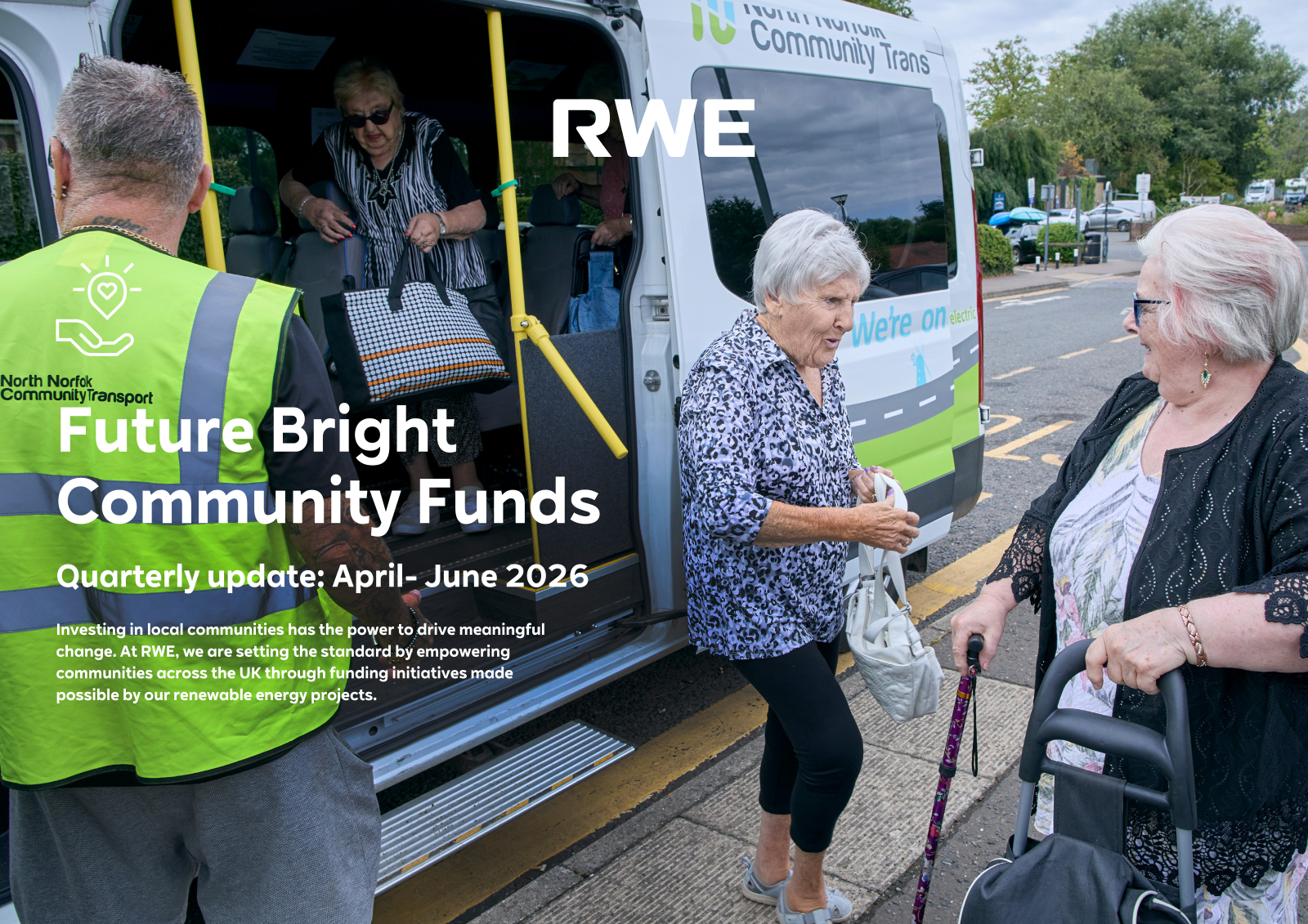 Three older women and a volunteer by a white and green minibus labeled "Future Bright Community Funds", one stepping down, one seated in a wheelchair.