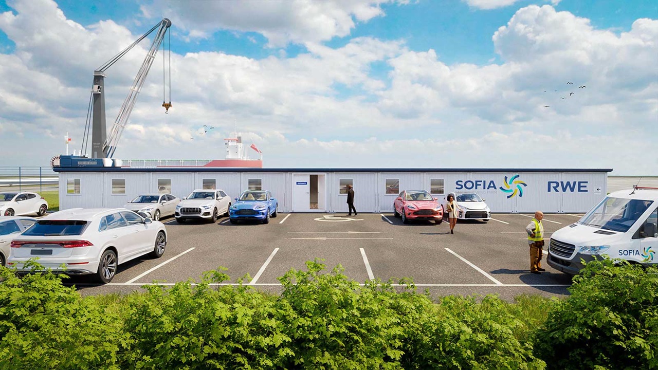 A service area featuring multiple parked cars, a container building with Sofia and RWE logos, and a crane in a sunny setting.