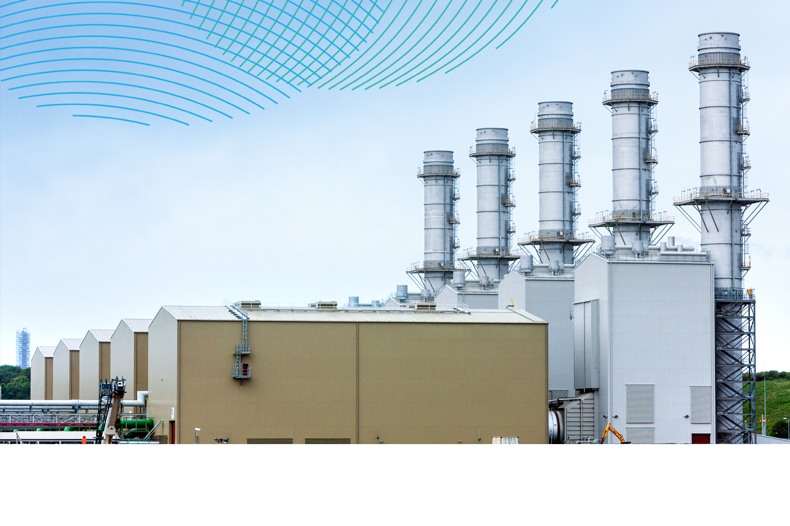 A power facility featuring several tall chimneys and large industrial buildings under a cloudy sky.