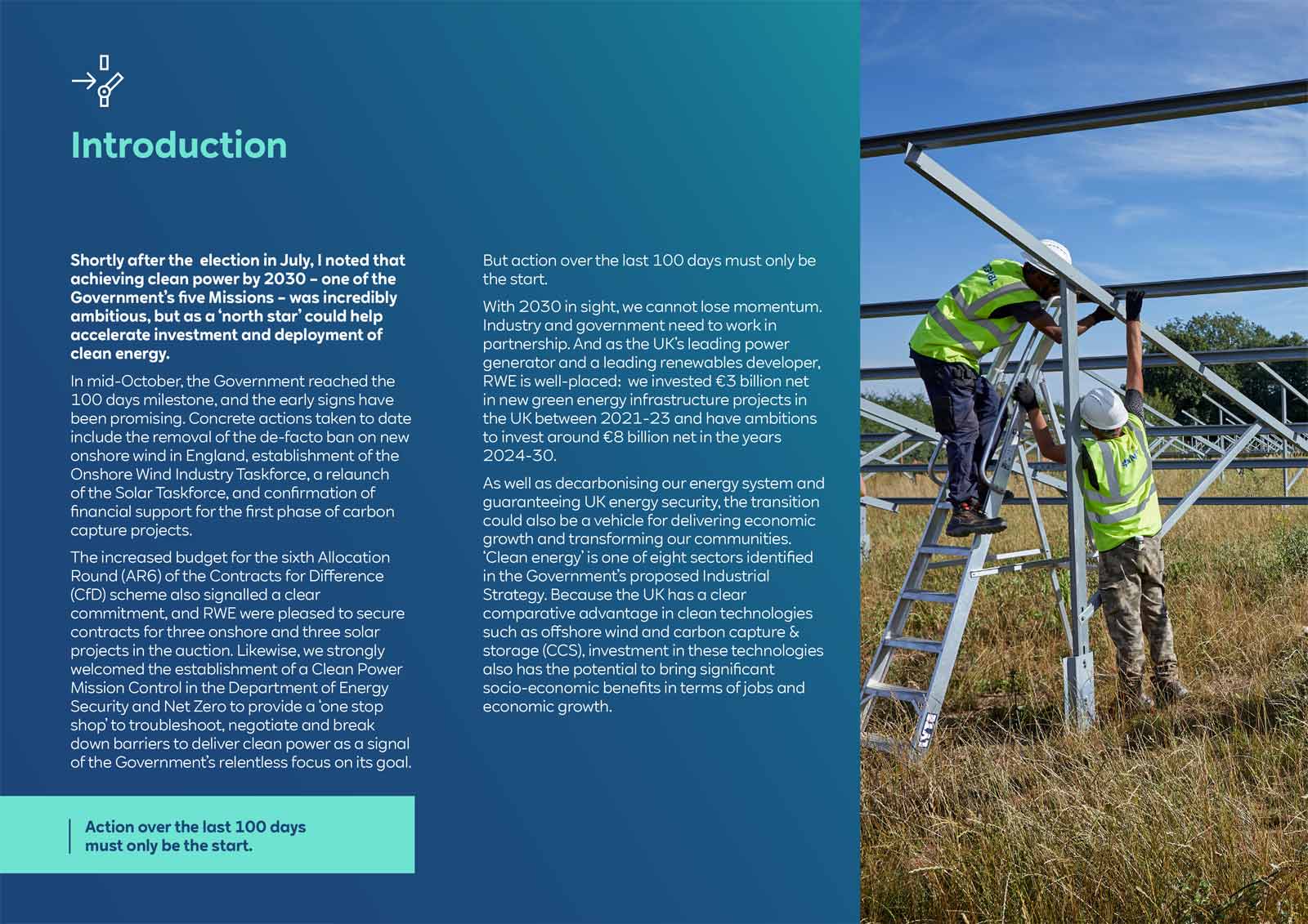 Two workers in high-visibility vests install metal framework in a grassy area, promoting clean energy initiatives.