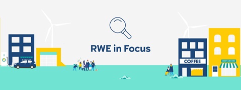 A vibrant urban scene featuring buildings like a barbershop, coffee shop, and green grocers, with wind turbines and people enjoying the area.