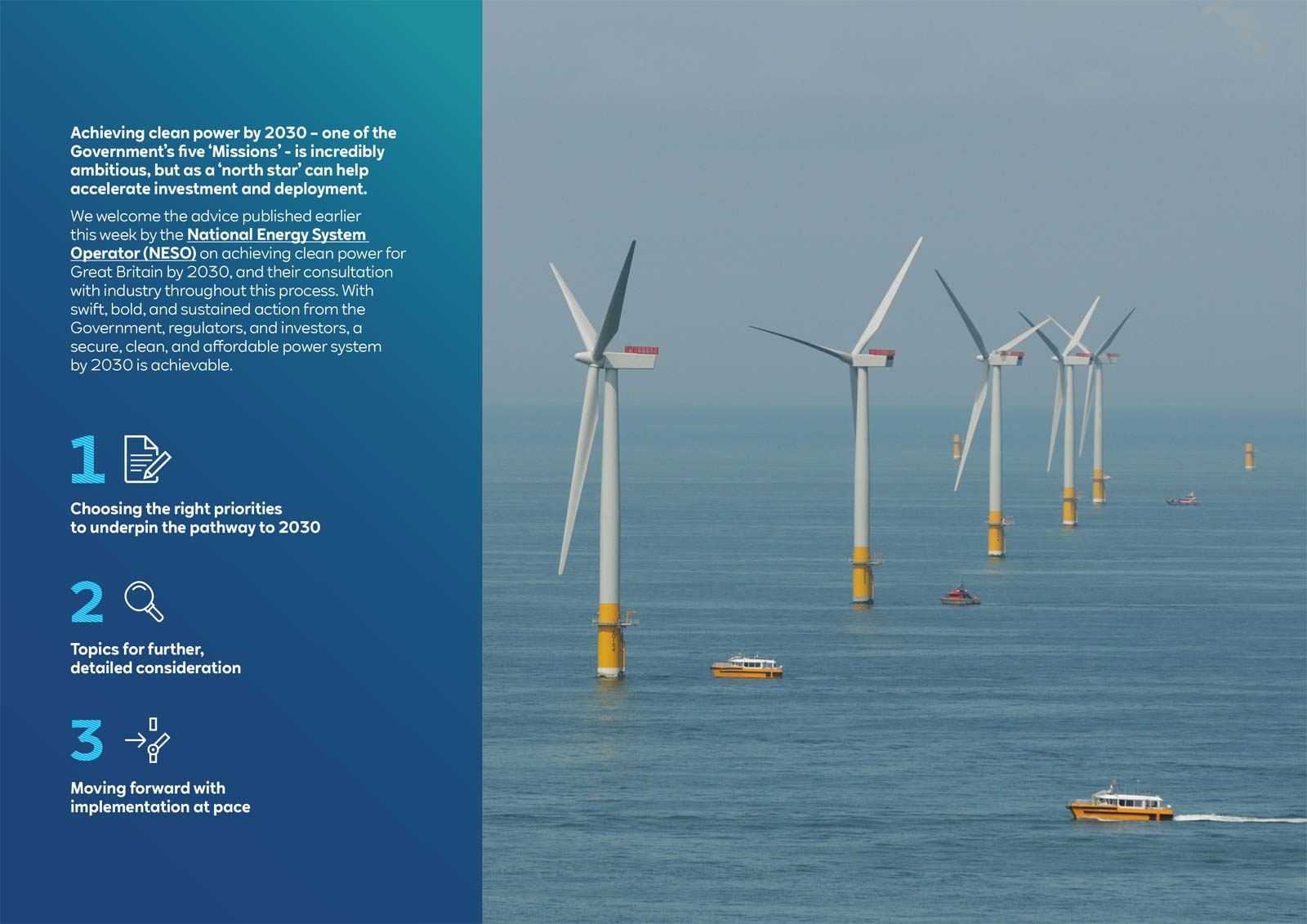 Offshore wind farm with several wind turbines in the ocean, and boats navigating nearby under a clear sky.